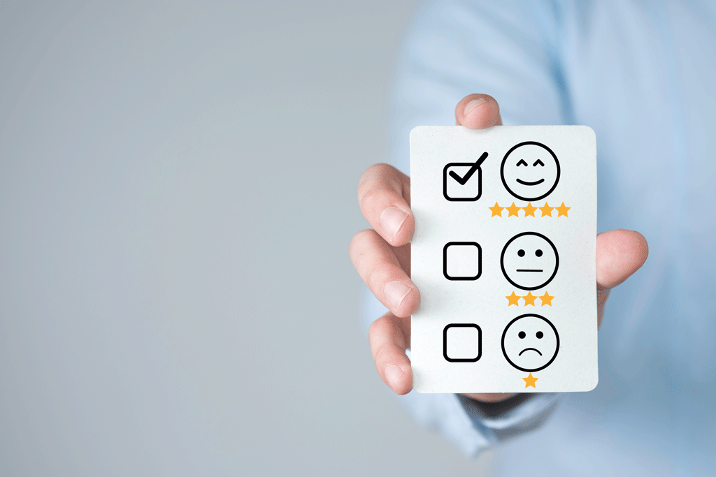 man holding a card with a check mark on a smiley face with 5 stars electrican wilmington nc