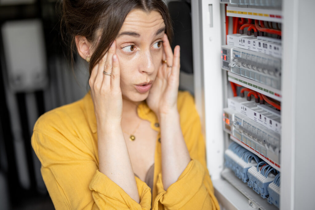 Confused woman having problems with electricity at home, Breaker Labeling Standards That Make Troubleshooting Faster.