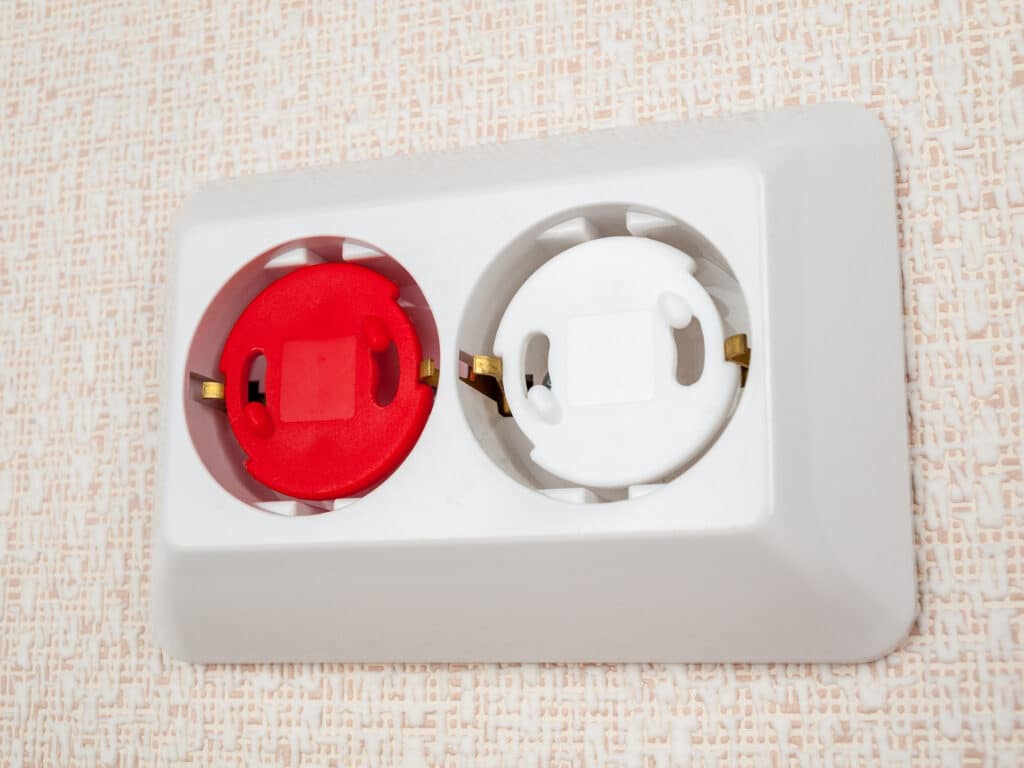 Plugs for electrical outlets to protect young children from electric shock.