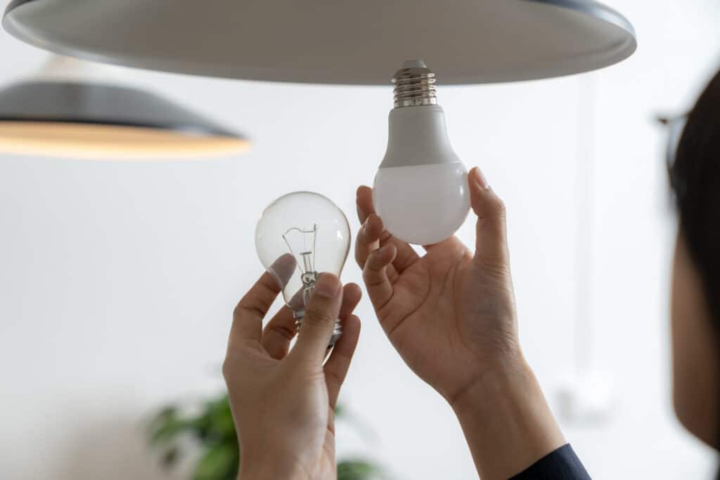 Changing a light bulb from incandescent to LED can help eliminate flickering lights caused by old or inefficient bulbs.