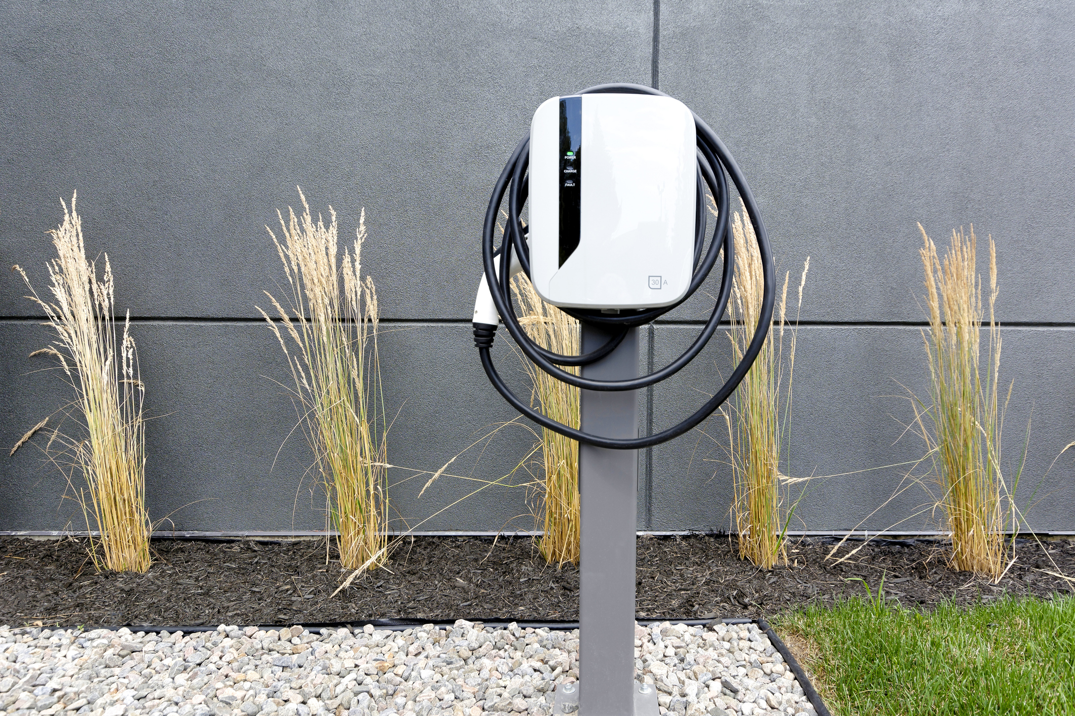 EV Home Charging Station and grey wall.